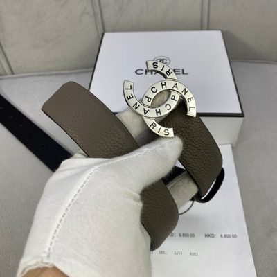 Chanel belt features a taupe, caviar-textured leather strap and a distinctive gold-tone logo buckle — 7