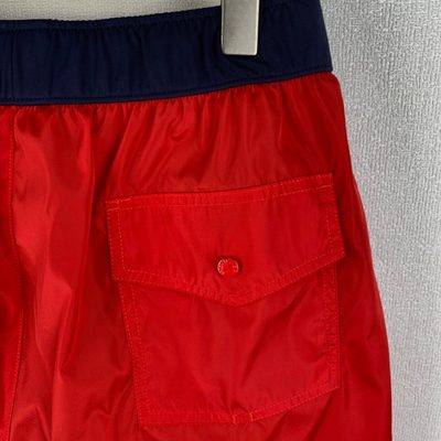 Moncler logo patch swim shorts in red — 4