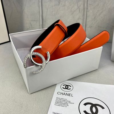 Chanel women's belt features a vibrant orange leather strap paired with a silver-tone, rhinestone-em — 3