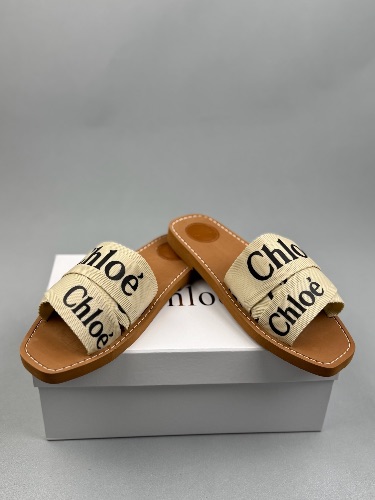 Chloé Woody flat sandals in a white and beige canvas colorway — 4
