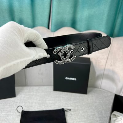 Chanel quilted leather belt featuring a prominent interlocking gold-tone CC buckle — 9