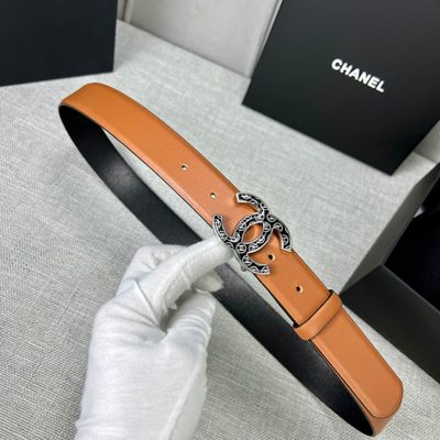 Chanel C100 belt features a distinctive black and gold CC logo buckle — 6