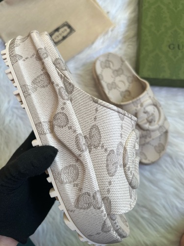 Gucci GG Slide Sandals in a beige interlocking G design — 3