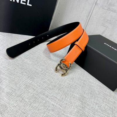 Chanel orange belt features a textured leather strap and a distinctive CC logo buckle — 4
