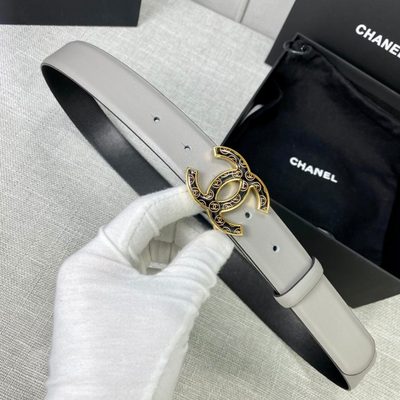 Chanel grey leather belt featuring a distinctive patterned silver-tone CC logo buckle — 6