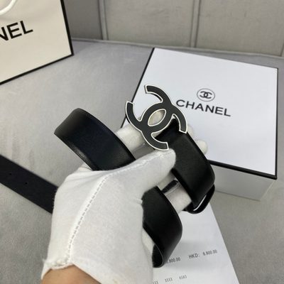 Chanel belt features a distinctive black and gold interlocking CC logo buckle — 4
