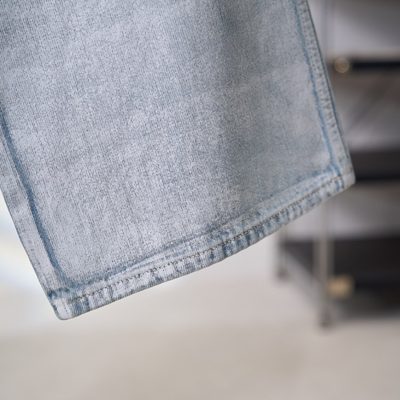 Acne Studios belted denim trousers featuring a light-washed — 8