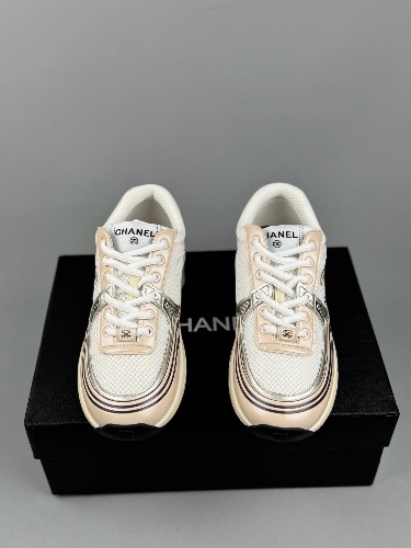 Chanel CC Runner sneakers in a white, beige, and gold colorway — 3