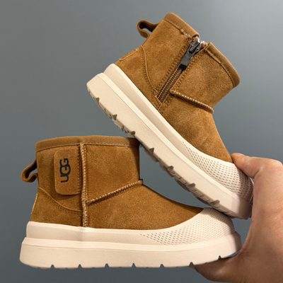 UGG-branded platform or utility-style ankle boots — 9