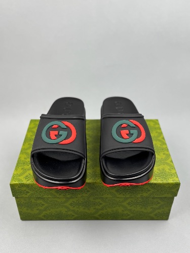Gucci Rubber Slide Sandals in black with the interlocking G logo — 3