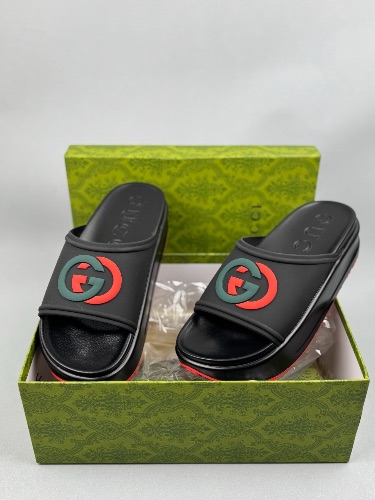 Gucci Rubber Slide Sandals in black with the interlocking G logo