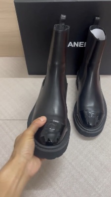 Chanel 22A black calfskin and patent leather cap-toe ankle boots — 5