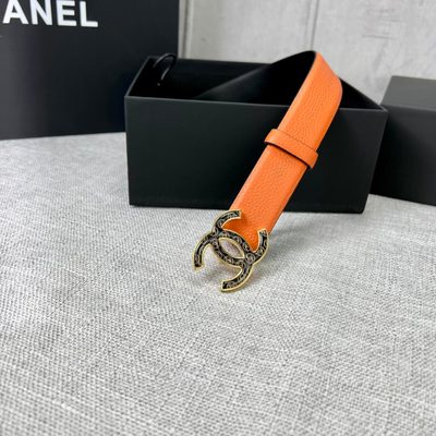 Chanel orange belt features a textured leather strap and a distinctive CC logo buckle — 3