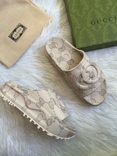 Gucci GG Slide Sandals in a beige interlocking G design