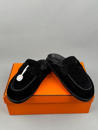 Hermès Go Mules featuring a penny strap design and white stitching details — 4
