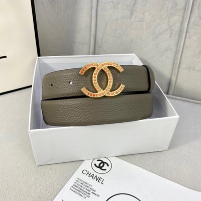 Chanel belt featuring a gold-toned CC logo buckle embellished with orange stones — 3