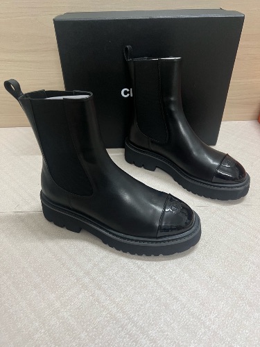 Chanel 22A black calfskin and patent leather cap-toe ankle boots — 4