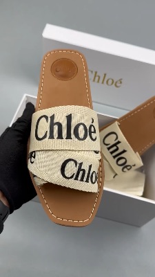 Chloé Woody flat sandals in a white and beige canvas colorway — 5