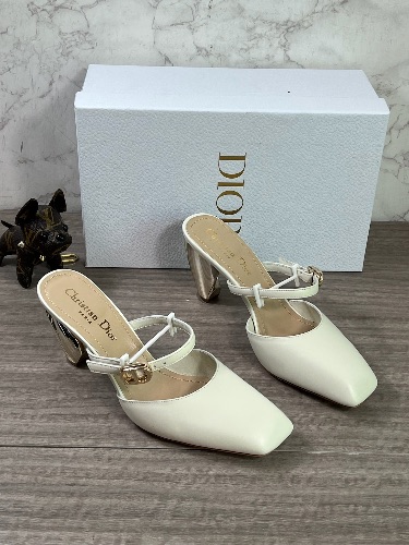 Dior mules featuring a square toe and a gold metallic block heel