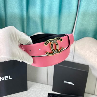 Chanel leather belt features a vibrant pink strap paired with a gold-tone CC buckle — 4