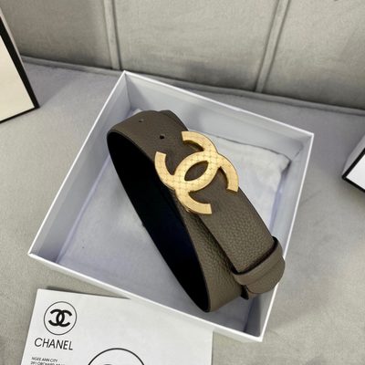 Chanel belt features a taupe-colored grained leather strap and a gold-tone "CC" logo buckle — 3