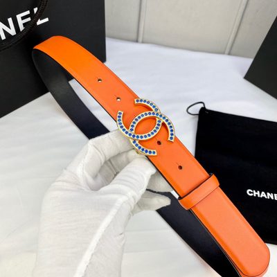 Chanel orange grained calfskin belt featuring a silver-tone interlocking CC buckle with navy blue de — 6