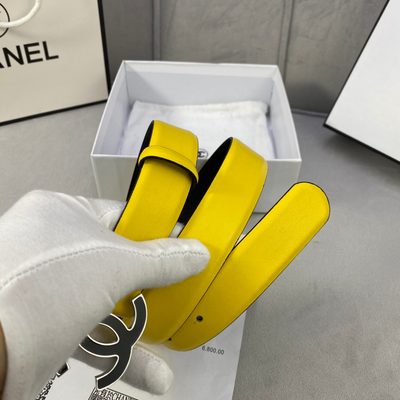 Chanel belt features a vibrant yellow leather strap and a distinctive black and gold CC logo buckle — 5