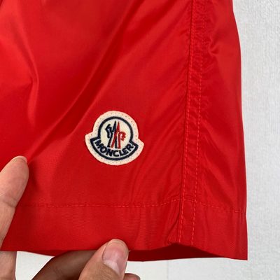 Moncler logo patch swim shorts in red — 9