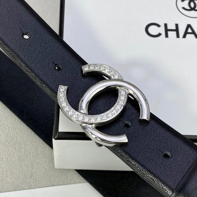 Chanel belt features a distinctive black leather strap paired with a gold-tone CC logo buckle — 5