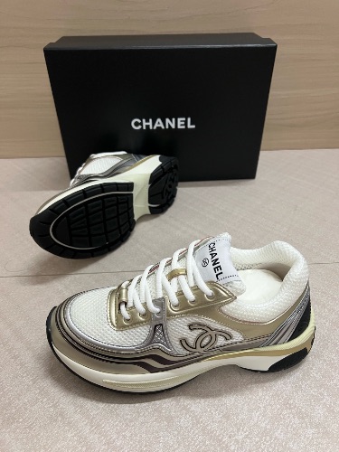 Chanel CC Runner sneakers in white, gold, and silver