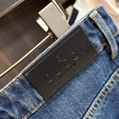 Gucci blue denim trucker jacket and matching relaxed-fit blue jeans — 12