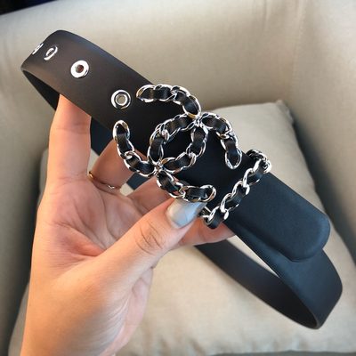 Chanel belt features a black leather strap and a silver chain interlocking CC logo buckle — 6