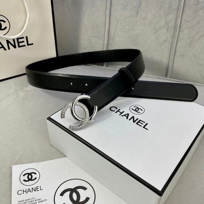 Chanel belt features a distinctive black leather strap paired with a gold-tone CC logo buckle — 7
