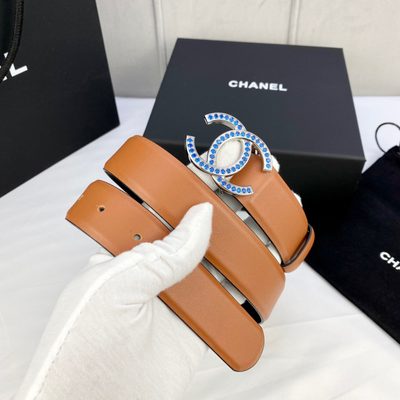 Chanel belt features a camel-colored leather strap and a gold CC logo buckle — 9