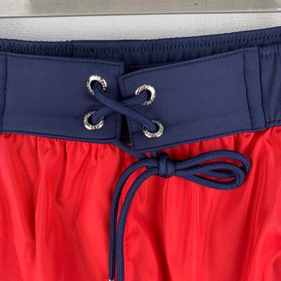 Moncler logo patch swim shorts in red — 5