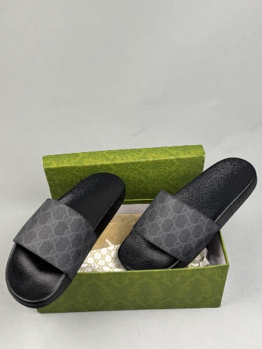 Gucci GG Supreme slides in black and grey