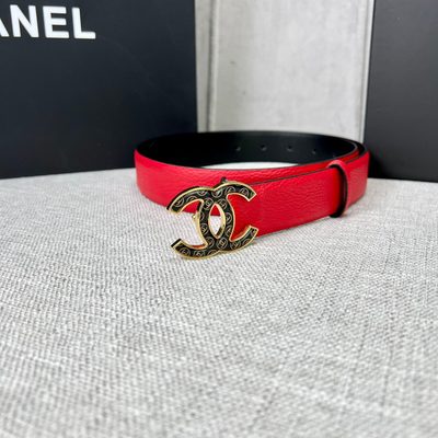 Chanel leather belt features a vibrant red calfskin strap and a distinctive silver CC logo buckle — 8