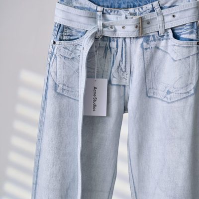 Acne Studios belted denim trousers featuring a light-washed — 6