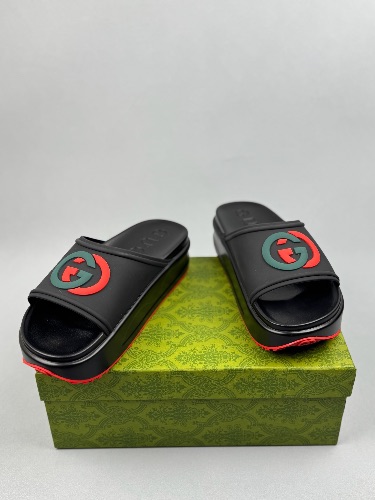 Gucci Rubber Slide Sandals in black with the interlocking G logo — 4