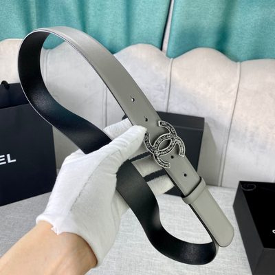 Chanel grey leather belt featuring a distinctive patterned silver-tone CC logo buckle — 3