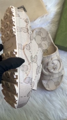 Gucci GG Slide Sandals in a beige interlocking G design — 5