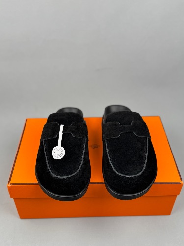 Hermès Go Mules featuring a penny strap design and white stitching details — 3