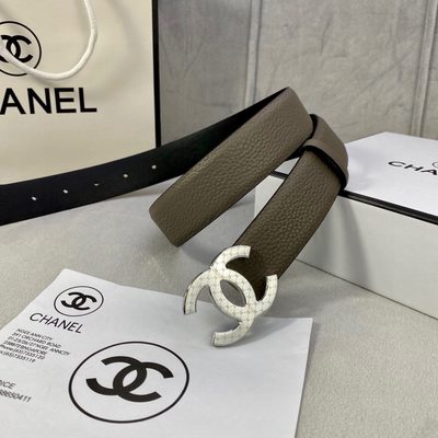 Chanel belt features a taupe-colored grained leather strap and a gold-tone "CC" logo buckle — 7