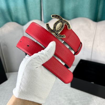 Chanel leather belt features a vibrant red calfskin strap and a distinctive silver CC logo buckle — 7