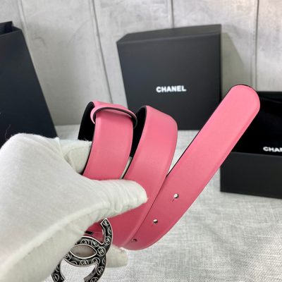 Chanel leather belt features a vibrant pink strap paired with a gold-tone CC buckle — 9