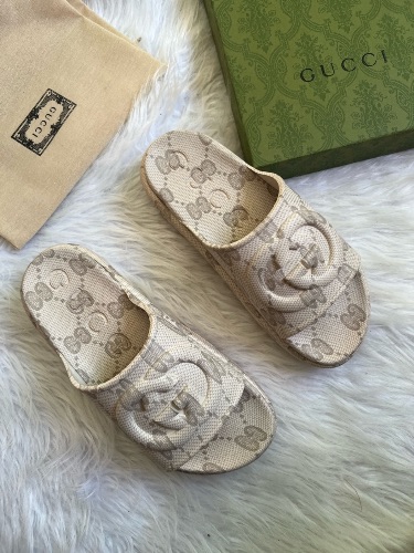 Gucci GG Slide Sandals in a beige interlocking G design — 4