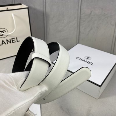 Chanel white calfskin leather belt featuring a prominent black and gold-tone metal CC logo buckle — 3