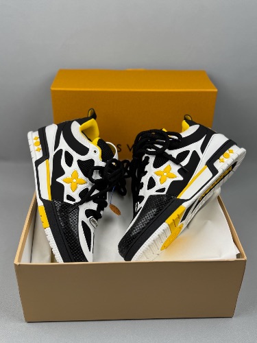 Louis Vuitton LV Skate Sneakers in a white, black, and yellow colorway