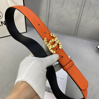 Chanel orange leather belt featuring a circular interlocking CC buckle — 4