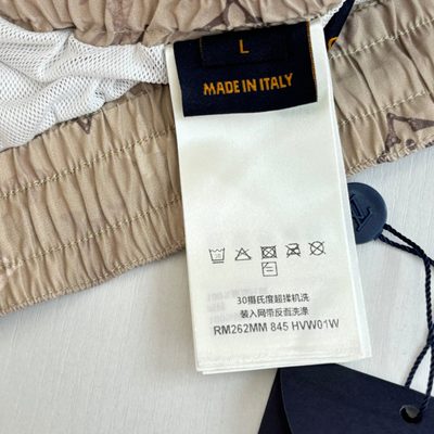 Louis Vuitton beige Monogram swim shorts — 12